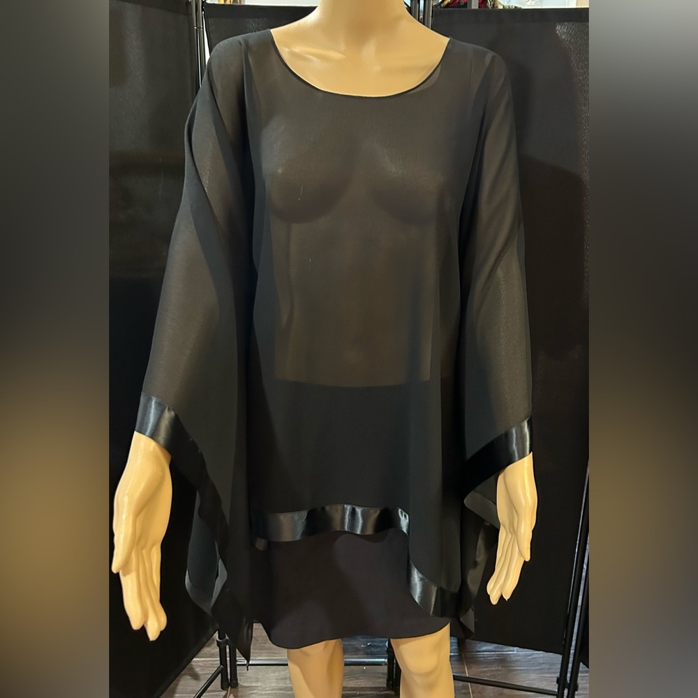 Black sheer shawl with satin edging. Scarf